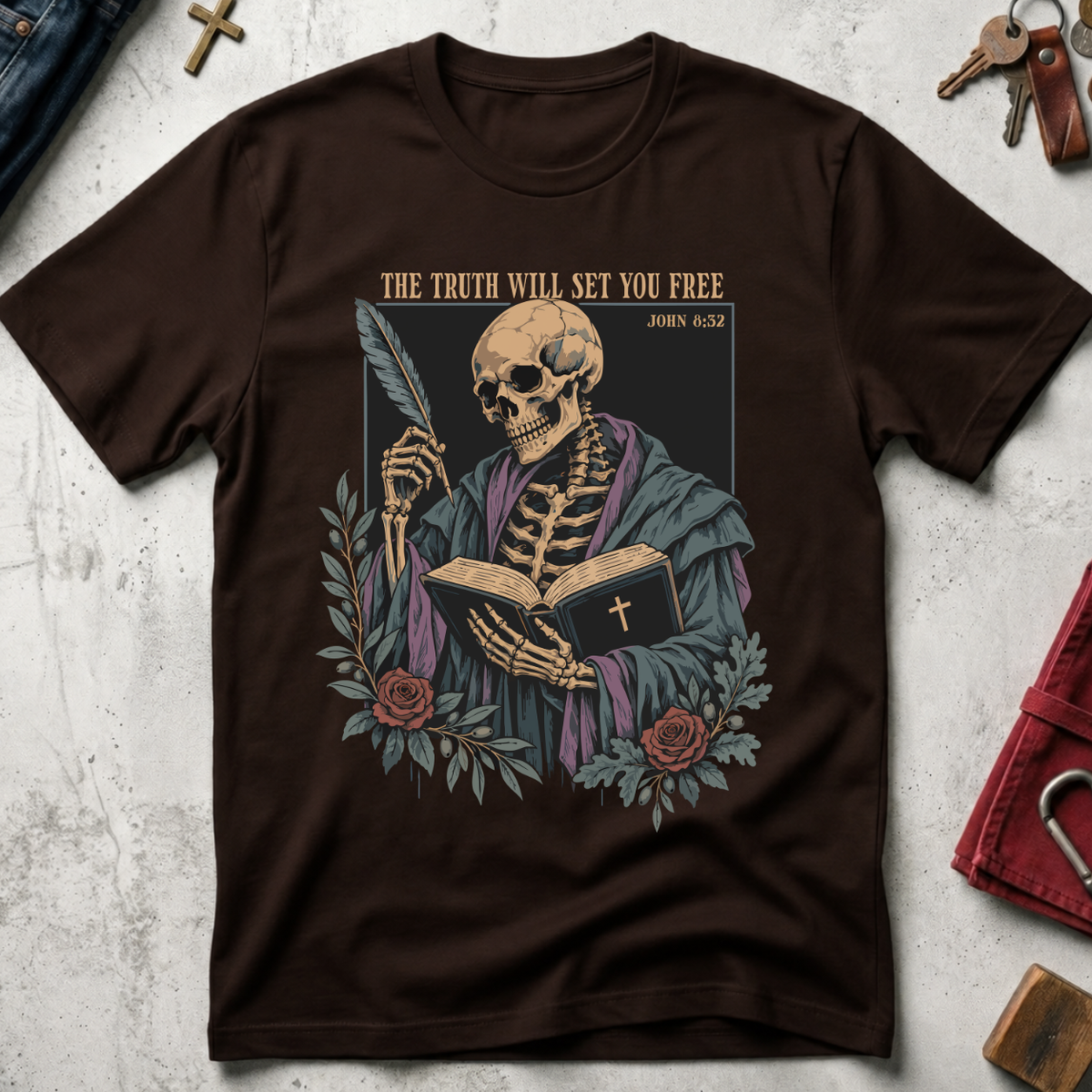 The Truth Will Set You Free Christian T-shirt in Dark Chocolate with a robed skeleton, open Bible, feather and roses.