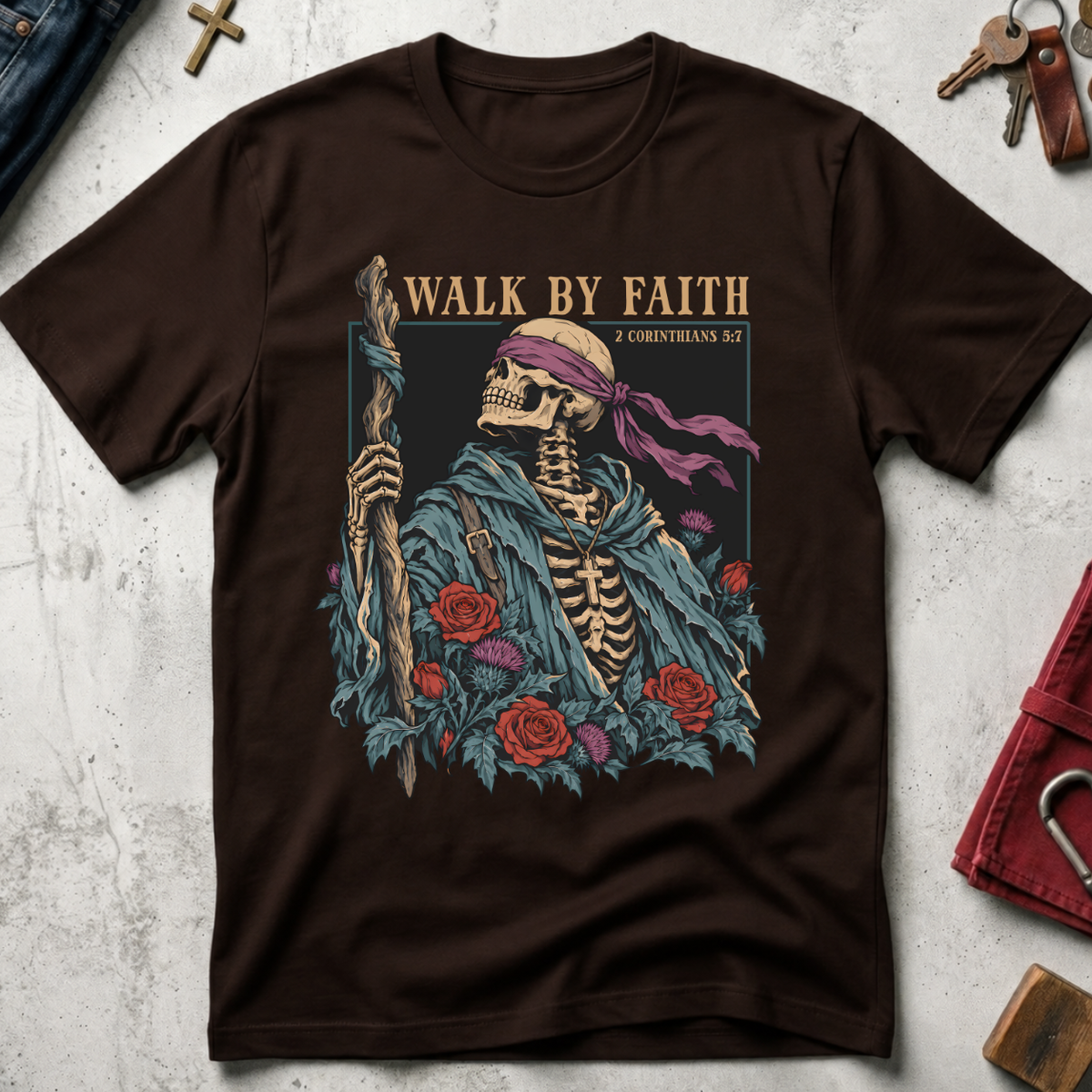 Walk by Faith Christian T-shirt in Dark Chocolate with a gothic skeleton pilgrim, wooden staff, cross necklace, roses and thistles.