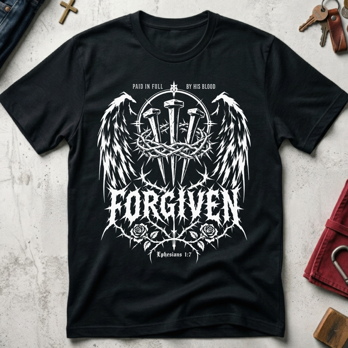 Forgiven Ephesians 1:7 Christian T-shirt in Black with gothic wings, three nails, a crown of thorns and roses.