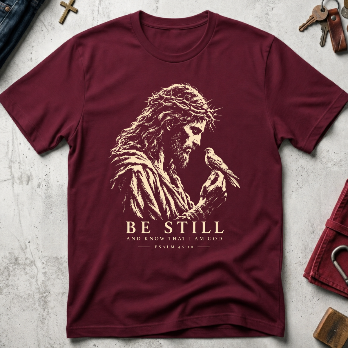 Be Still and Know Psalm 46:10 Christian T-shirt in Maroon with Jesus and bird illustration