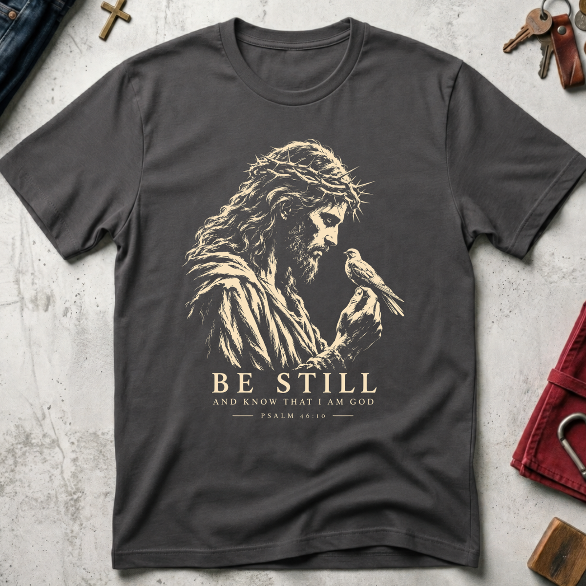 Be Still and Know Psalm 46:10 Christian T-shirt in Charcoal with Jesus and bird illustration
