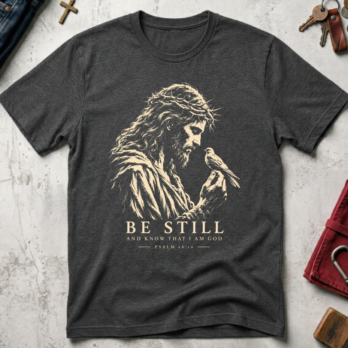 Be Still and Know Psalm 46:10 Christian T-shirt in Dark Heather with Jesus and bird illustration